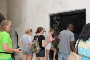 Whitewashed walls of Cape Coast Castle overlooking the Atlantic Ocean